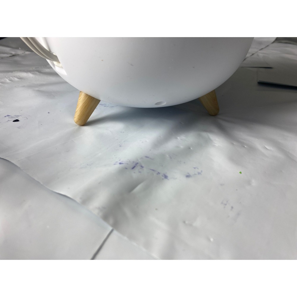 White Round Object with‎ Wooden Legs